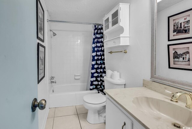 10200 Lake Shore Dr Unit 26, Myrtle Beach, SC 29572 - bathroom featuring a textured ceiling, tile patterned floors, vanity, and shower / bath combo with shower curtain