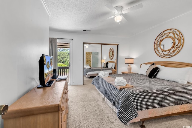 10200 Lake Shore Dr Unit 26, Myrtle Beach, SC 29572 - carpeted bedroom with access to outside, a ceiling fan, and a textured ceiling