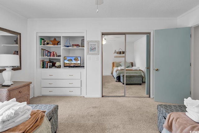 10200 Lake Shore Dr Unit 26, Myrtle Beach, SC 29572 - bedroom with crown molding, light colored carpet, a closet, and a ceiling fan