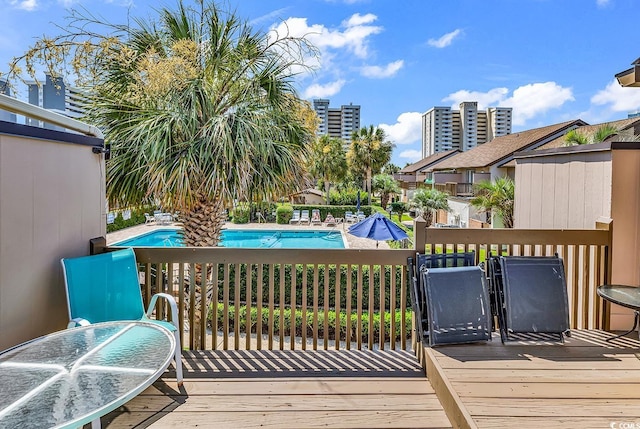 10200 Lake Shore Dr Unit 26, Myrtle Beach, SC 29572 - wooden deck with a community pool