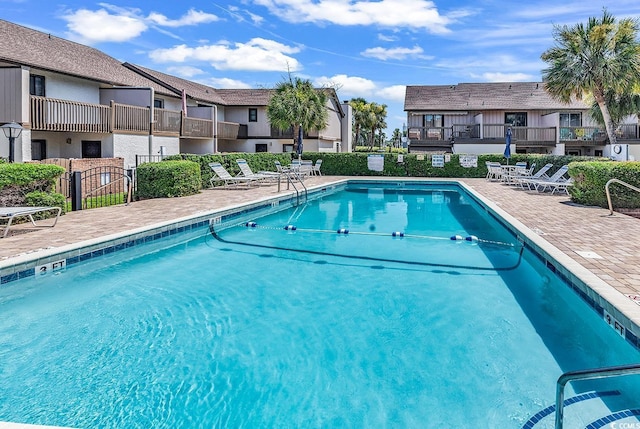 10200 Lake Shore Dr Unit 26, Myrtle Beach, SC 29572 - community pool featuring a residential view and a patio