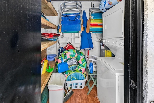 10200 Lake Shore Dr Unit 26, Myrtle Beach, SC 29572 - washroom with stacked washer / drying machine and wood finished floors