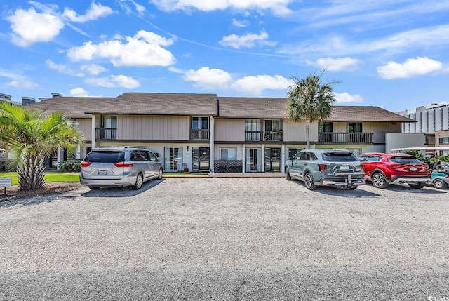 10200 Lake Shore Dr Unit 26, Myrtle Beach, SC 29572 - view of building exterior featuring uncovered parking