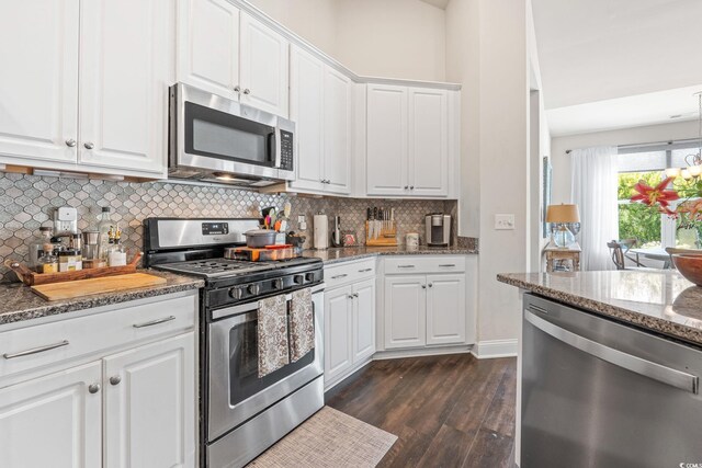 756 Culbertson Ave, Myrtle Beach, SC 29577 - kitchen with stainless steel appliances, dark wood-style flooring, decorative backsplash, white cabinetry, and dark stone counters