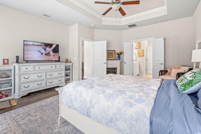 756 Culbertson Ave, Myrtle Beach, SC 29577 - bedroom with wood finished floors, a raised ceiling, ornamental molding, ensuite bath, and ceiling fan