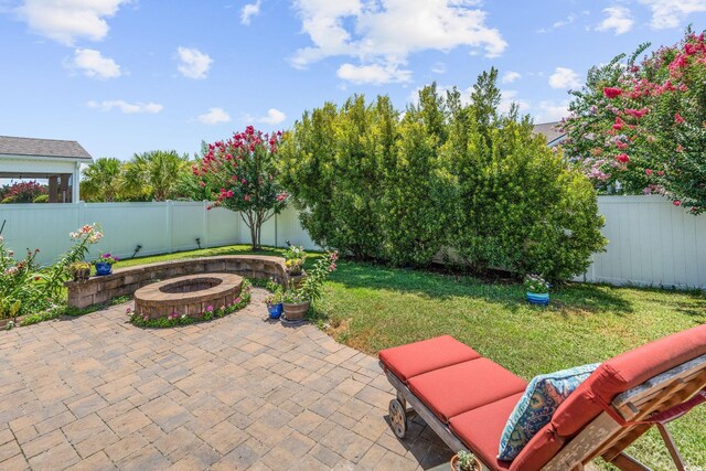 756 Culbertson Ave, Myrtle Beach, SC 29577 - fenced backyard featuring a fire pit and a patio area