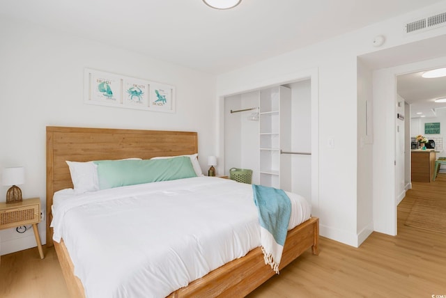 5700 Nixon St, North Myrtle Beach, SC 29582 - bedroom with light wood-style flooring and a closet