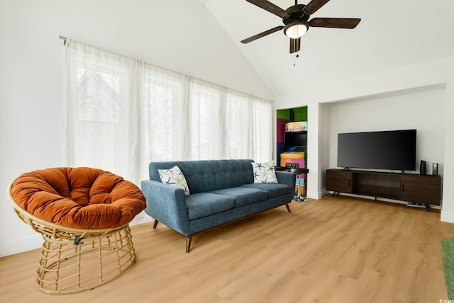 5700 Nixon St, North Myrtle Beach, SC 29582 - living room with wood finished floors, high vaulted ceiling, healthy amount of natural light, and a ceiling fan