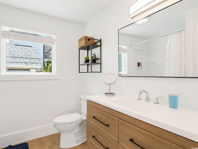 5700 Nixon St, North Myrtle Beach, SC 29582 - full bath with vanity, wood finished floors, and a shower with curtain