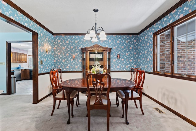 218 Lander Dr, Conway, SC 29526 - dining space featuring ornamental molding, wallpapered walls, a chandelier, and light colored carpet