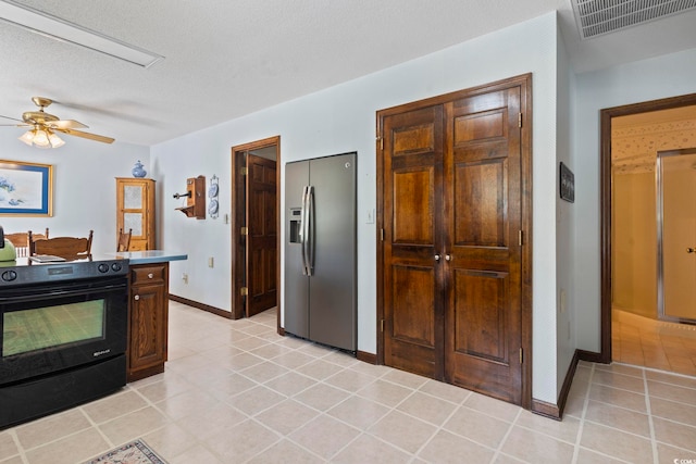 218 Lander Dr, Conway, SC 29526 - kitchen with stainless steel refrigerator with ice dispenser, electric range, a ceiling fan, light tile patterned floors, and a textured ceiling