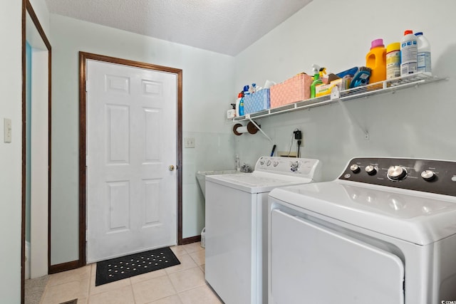 218 Lander Dr, Conway, SC 29526 - laundry room with washer and dryer, light tile patterned floors, and a textured ceiling