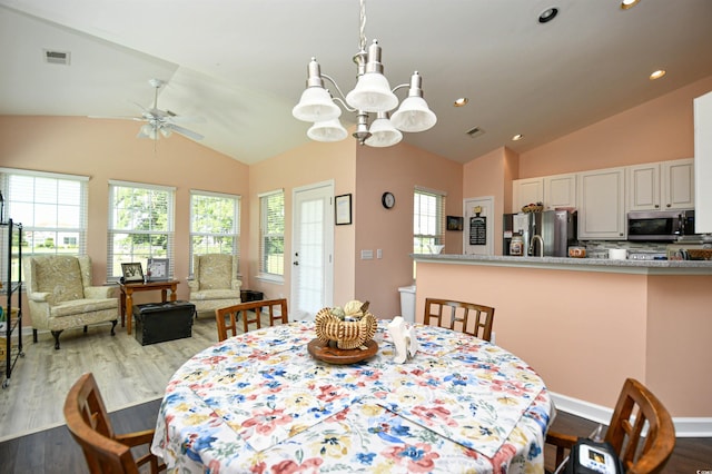 434 Deerfield Links Dr, Surfside Beach, SC 29575 - dining room featuring lofted ceiling, wood finished floors, a ceiling fan, a chandelier, and recessed lighting
