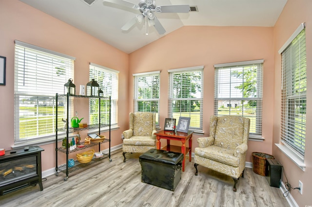 434 Deerfield Links Dr, Surfside Beach, SC 29575 - sitting room with wood finished floors, a ceiling fan, lofted ceiling, plenty of natural light, and a wood stove