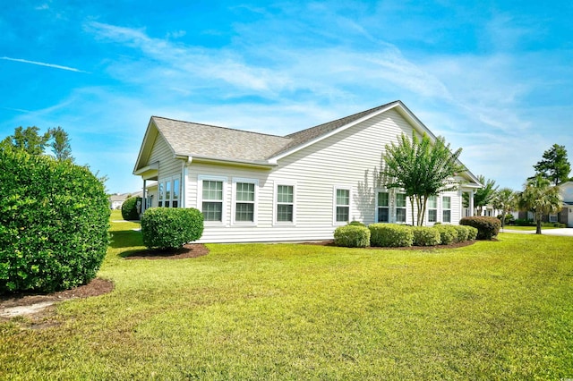 434 Deerfield Links Dr, Surfside Beach, SC 29575 - back of property with roof with shingles and a lawn
