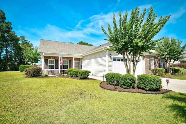 434 Deerfield Links Dr, Surfside Beach, SC 29575 - view of front of home with an attached garage, a porch, a front lawn, concrete driveway, and brick siding