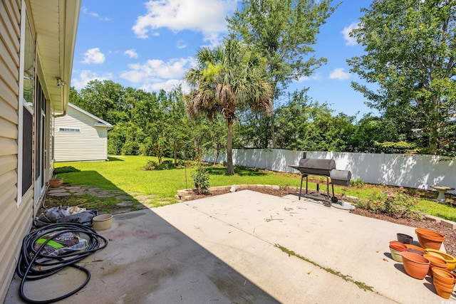 371 Sea Turtle Dr, Myrtle Beach, SC 29588 - fenced backyard with a patio area, area for grilling, and view of wooded area