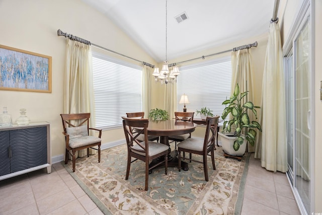 371 Sea Turtle Dr, Myrtle Beach, SC 29588 - dining room with light tile patterned floors, vaulted ceiling, and a chandelier