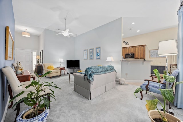 371 Sea Turtle Dr, Myrtle Beach, SC 29588 - living room featuring light colored carpet, a ceiling fan, recessed lighting, and a towering ceiling