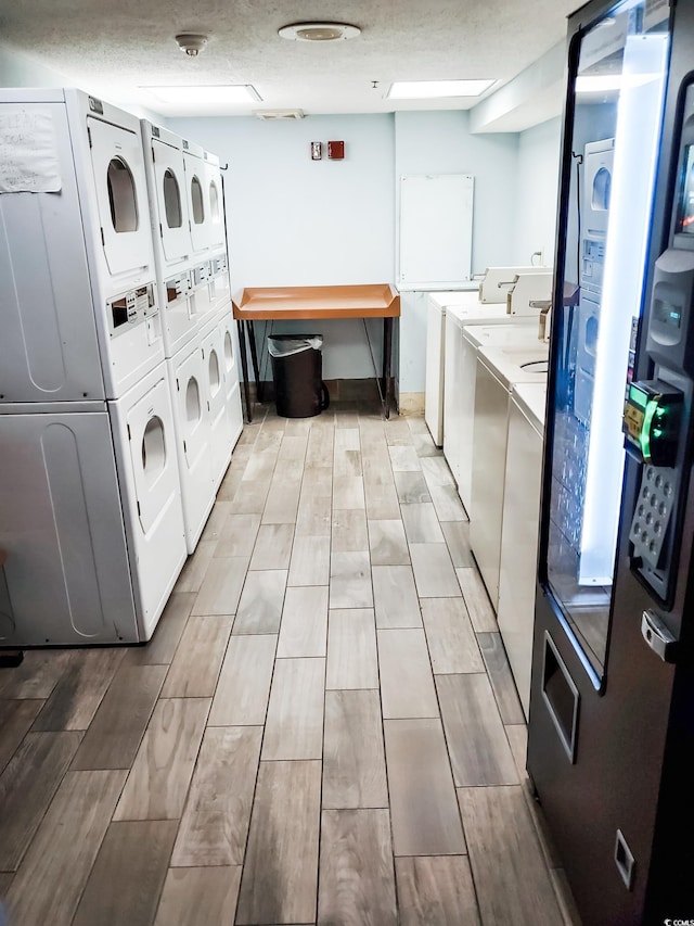 6804 N Ocean Blvd Unit 1621, Myrtle Beach, SC 29572 - shared laundry room featuring estacked washer and dryer, wood tiled floors, and separate washer and dryer
