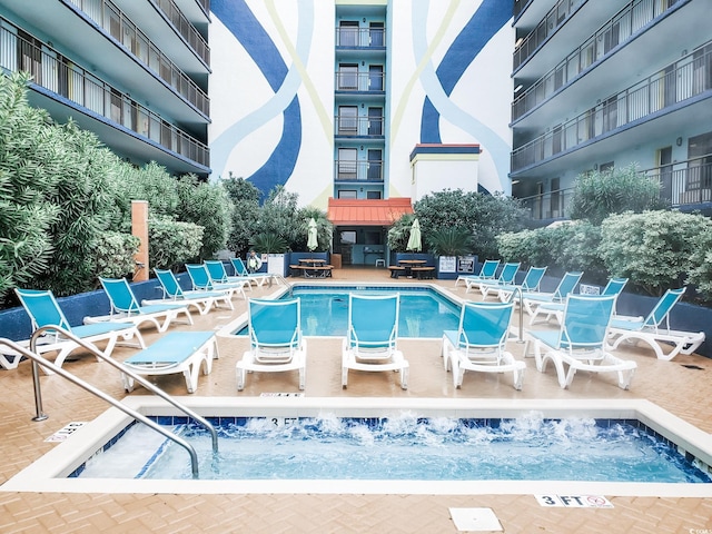 6804 N Ocean Blvd Unit 1621, Myrtle Beach, SC 29572 - community pool with an outdoor hot tub and a patio