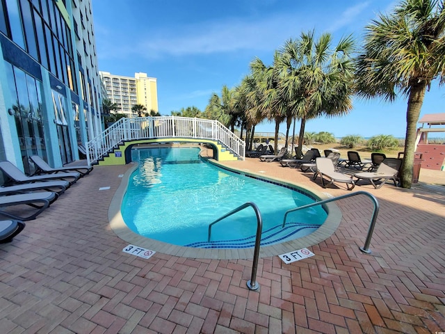 6804 N Ocean Blvd Unit 1621, Myrtle Beach, SC 29572 - community pool featuring stairs and a patio area