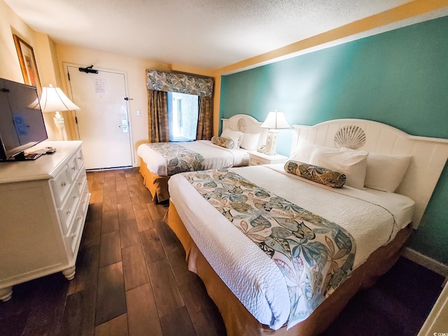 6804 N Ocean Blvd Unit 1621, Myrtle Beach, SC 29572 - bedroom featuring dark wood-style flooring
