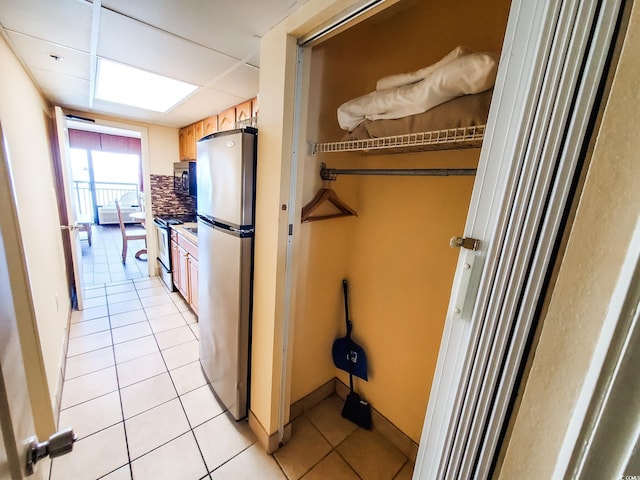 6804 N Ocean Blvd Unit 1621, Myrtle Beach, SC 29572 - kitchen featuring appliances with stainless steel finishes and light tile patterned floors