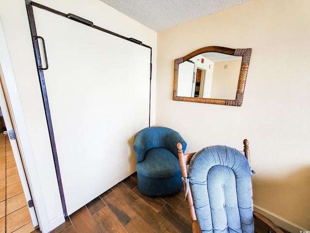 6804 N Ocean Blvd Unit 1621, Myrtle Beach, SC 29572 - living area featuring wood finished floors and a textured ceiling