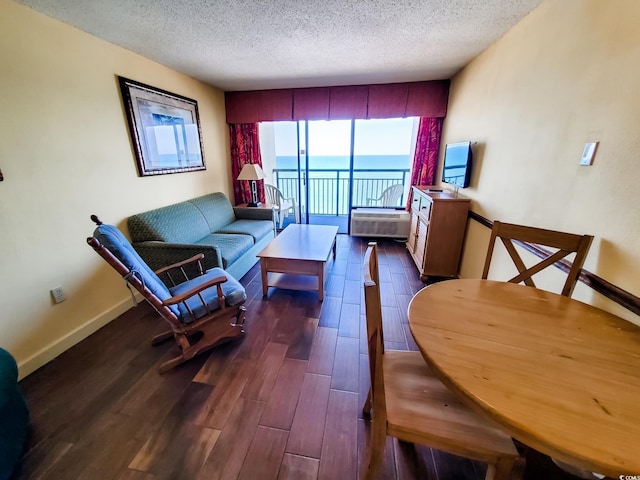 6804 N Ocean Blvd Unit 1621, Myrtle Beach, SC 29572 - living area featuring a textured ceiling and dark wood-style flooring