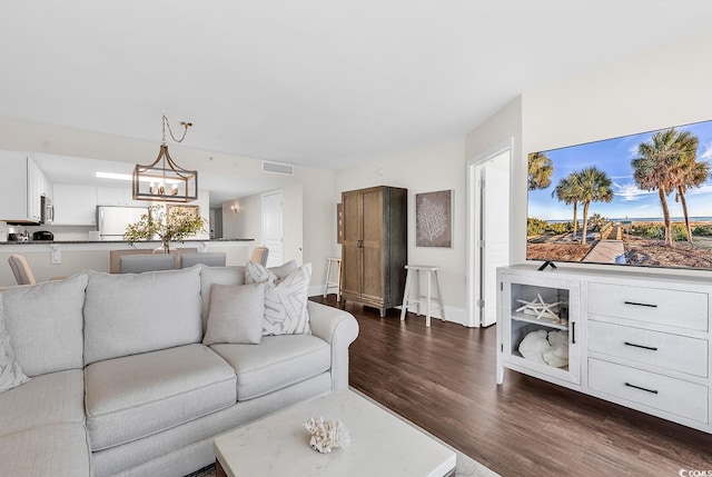 2701 S Ocean Blvd Unit 705, North Myrtle Beach, SC 29582 - living area featuring dark wood finished floors and a chandelier