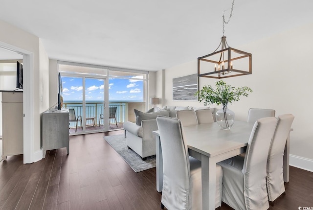 2701 S Ocean Blvd Unit 705, North Myrtle Beach, SC 29582 - dining room featuring a chandelier and dark wood finished floors