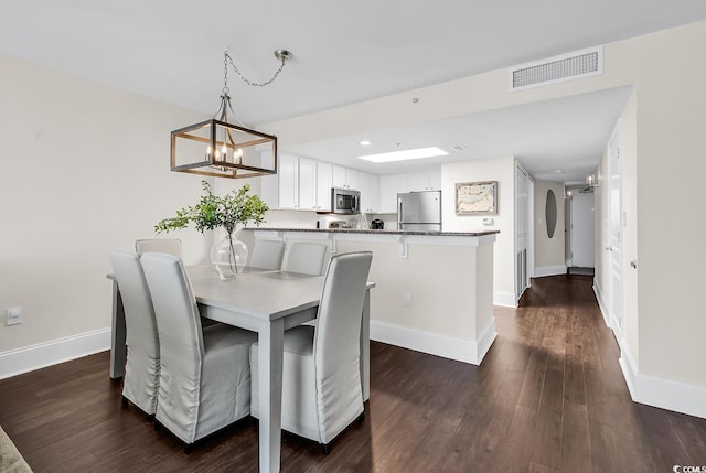 2701 S Ocean Blvd Unit 705, North Myrtle Beach, SC 29582 - dining space with dark wood-type flooring, a chandelier, and recessed lighting