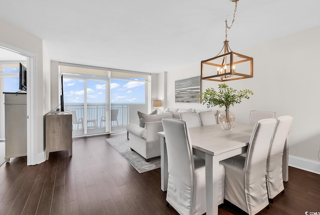 2701 S Ocean Blvd Unit 705, North Myrtle Beach, SC 29582 - dining room with a chandelier, dark wood finished floors, and floor to ceiling windows