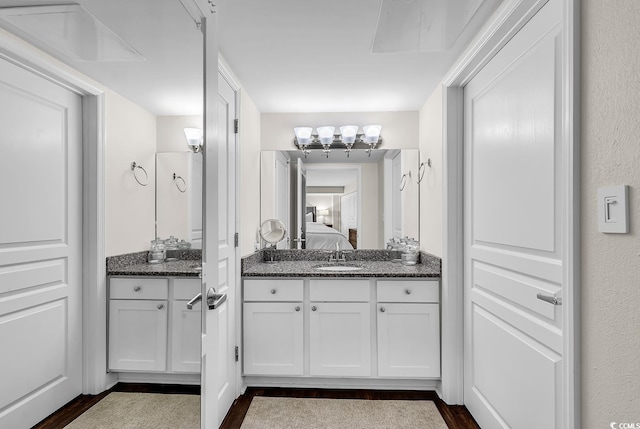 2701 S Ocean Blvd Unit 705, North Myrtle Beach, SC 29582 - ensuite bathroom featuring wood finished floors and vanity