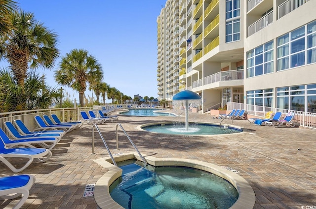 2701 S Ocean Blvd Unit 705, North Myrtle Beach, SC 29582 - community pool featuring a hot tub and a patio area