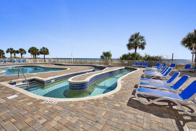 2701 S Ocean Blvd Unit 705, North Myrtle Beach, SC 29582 - community pool featuring a hot tub and a patio