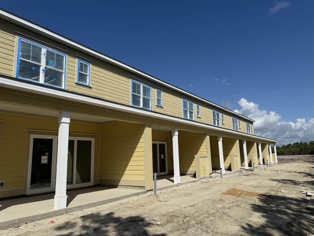 6876 Water Tower Rd Unit 101, Longs, SC 29568 - rear view of house featuring a patio area