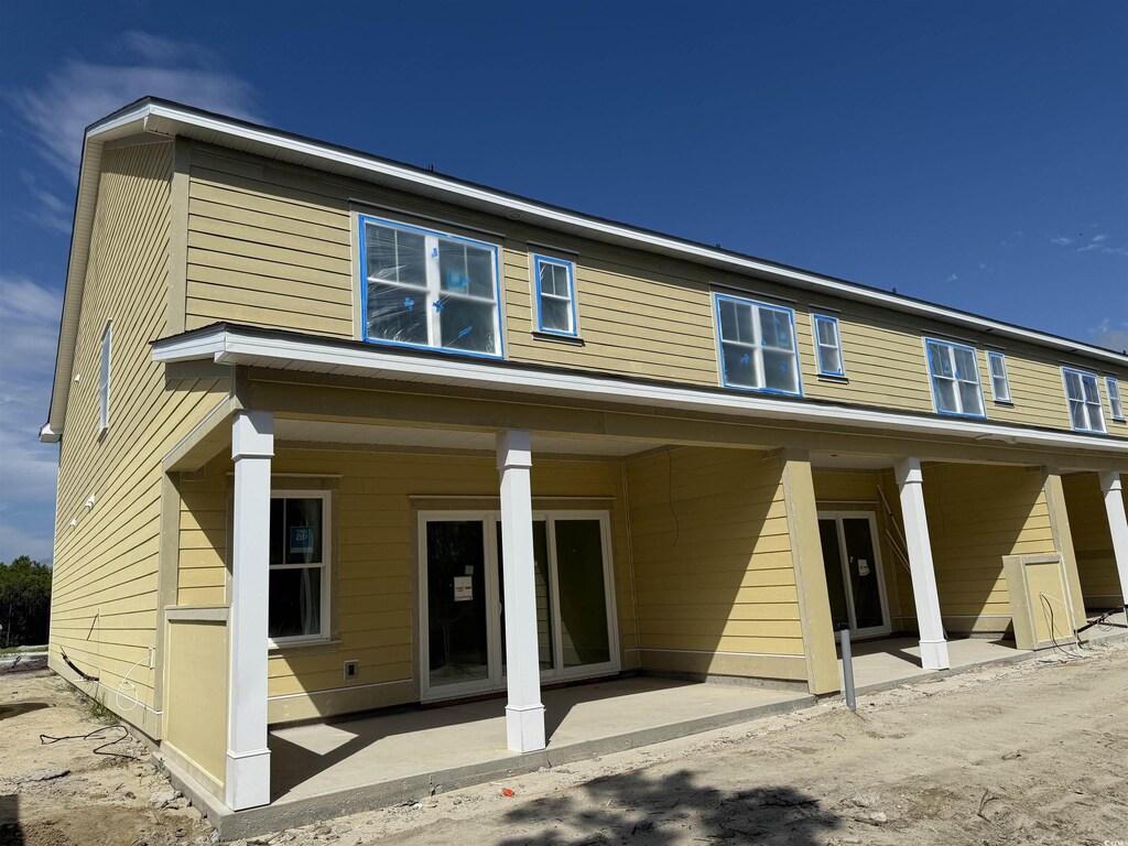 6876 Water Tower Rd Unit 101, Longs, SC 29568 - back of property with a patio