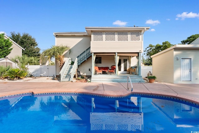 503 Plantation Dr, Surfside Beach, SC 29575 - back of property featuring stairs, a fenced backyard, a patio, and outdoor lounge area