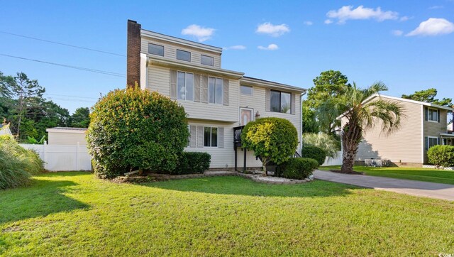 503 Plantation Dr, Surfside Beach, SC 29575 - bi-level home with a chimney