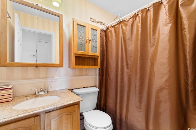 503 Plantation Dr, Surfside Beach, SC 29575 - bathroom with vanity, wainscoting, wallpapered walls, and a shower with curtain