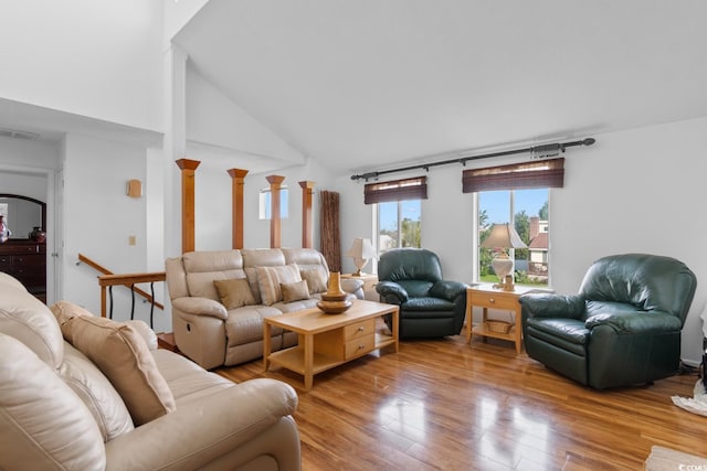 503 Plantation Dr, Surfside Beach, SC 29575 - living room featuring wood finished floors, high vaulted ceiling, and ornate columns