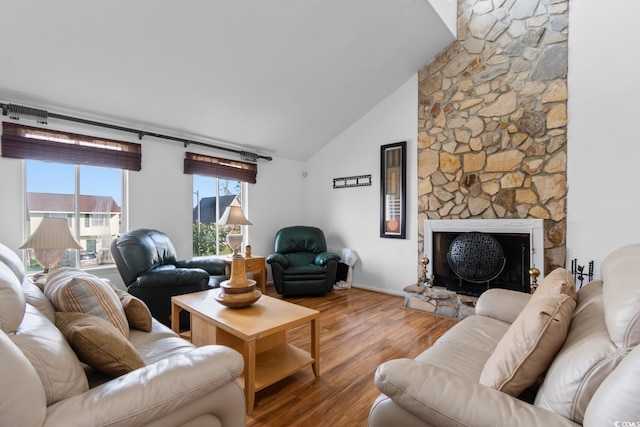 503 Plantation Dr, Surfside Beach, SC 29575 - living room with wood finished floors, a fireplace, and high vaulted ceiling