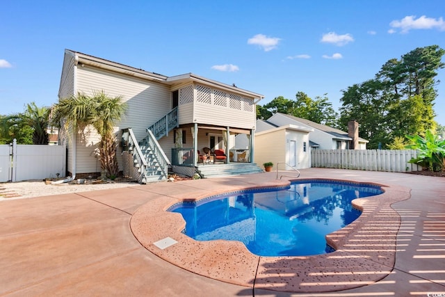 503 Plantation Dr, Surfside Beach, SC 29575 - view of swimming pool with a fenced backyard, stairway, a patio, and a gate