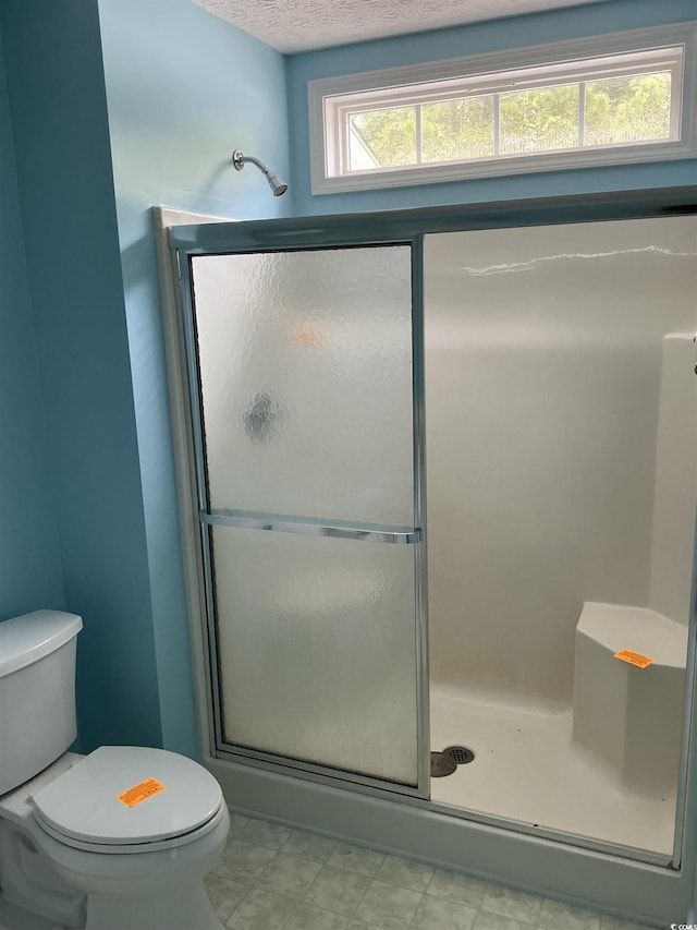 983 Nottingham Lakes Rd, Conway, SC 29526 - bathroom with a shower stall and a textured ceiling