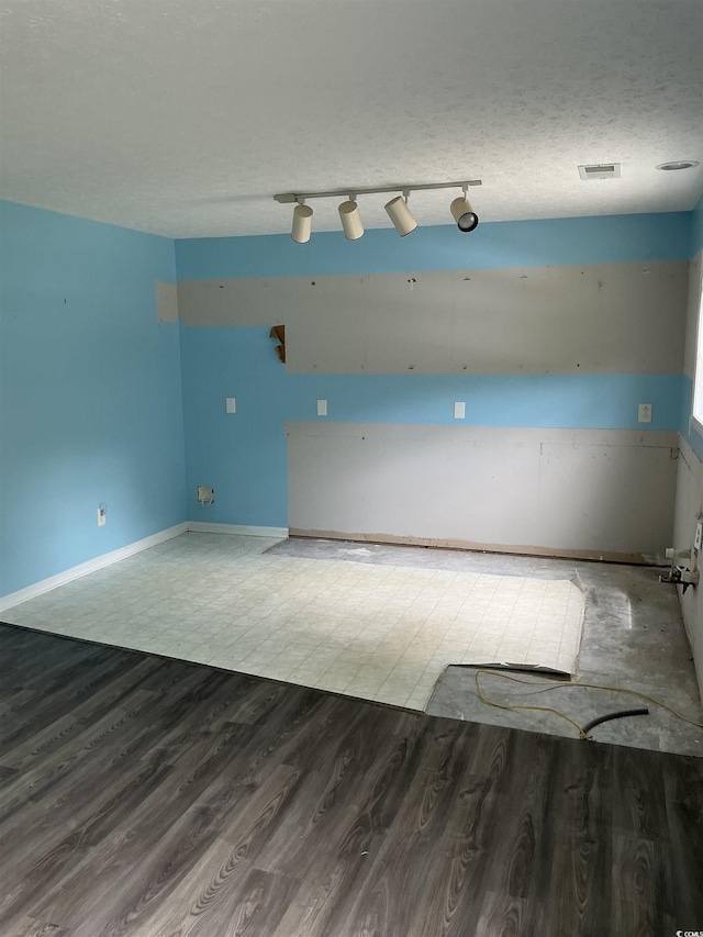 983 Nottingham Lakes Rd, Conway, SC 29526 - empty room with rail lighting and wood finished floors