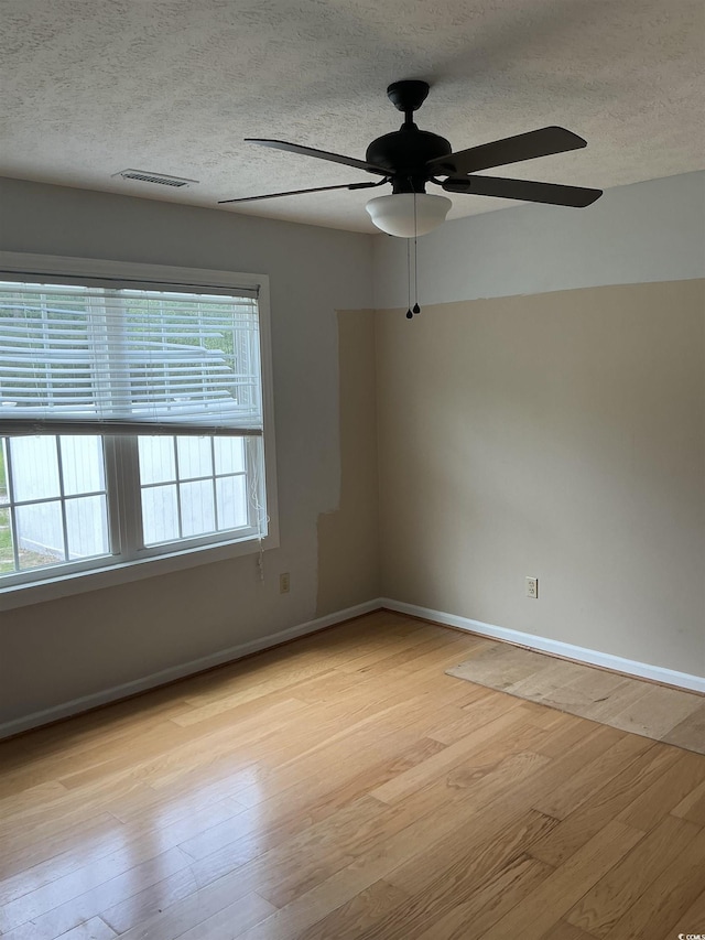 983 Nottingham Lakes Rd, Conway, SC 29526 - spare room with ceiling fan, a textured ceiling, and light wood finished floors
