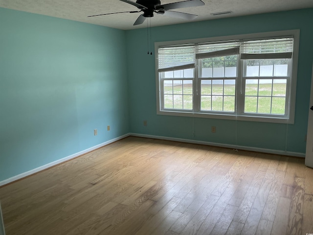 983 Nottingham Lakes Rd, Conway, SC 29526 - unfurnished room with ceiling fan, wood finished floors, and a textured ceiling