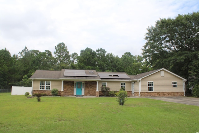 983 Nottingham Lakes Rd, Conway, SC 29526 - view of front of house featuring roof mounted solar panels and driveway